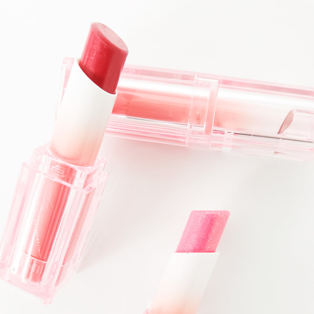 Labial en barra hidratante Ensueño Jarusa con efecto degradado bicolor en tono rojo y rosado detalle de textura