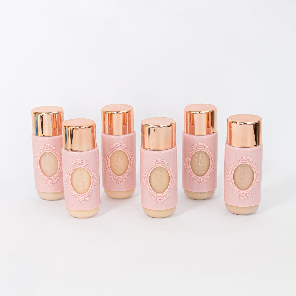 Base líquida crema en frasco rosa con tapa dorada en 6 tonos sobre fondo blanco — Reve'l Professional 43 ml