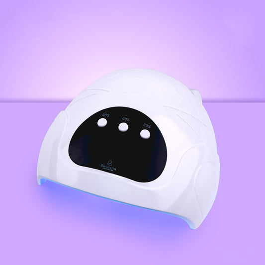 Lámpara UV LED para uñas Bellespa Cosmetics diseño osito variante Blanco con panel táctil negro y 3 temporizadores 30S 60S y 90S sobre fondo púrpura
