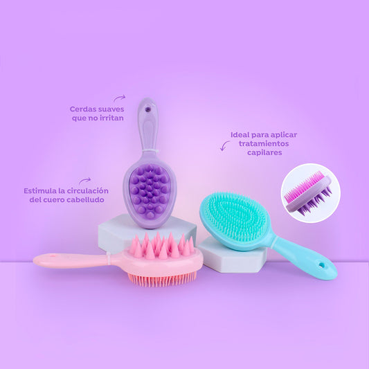 Cepillo masajeador scalp cuero cabelludo con cerdas suaves silicona en colores lila rosa y menta sobre fondo lila