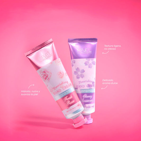 Crema de manos Nourishing Hand Cream 50g Reve'l Professional en fragancias Fresh Rose y Cherry Blossoms textura ligera no oleosa sobre fondo rosado