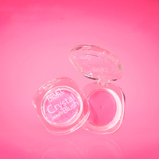 Crystal Magic Blush Rubor en Crema Reve'l empaque compacto transparente abierto con producto rosa sobre fondo fucsia
