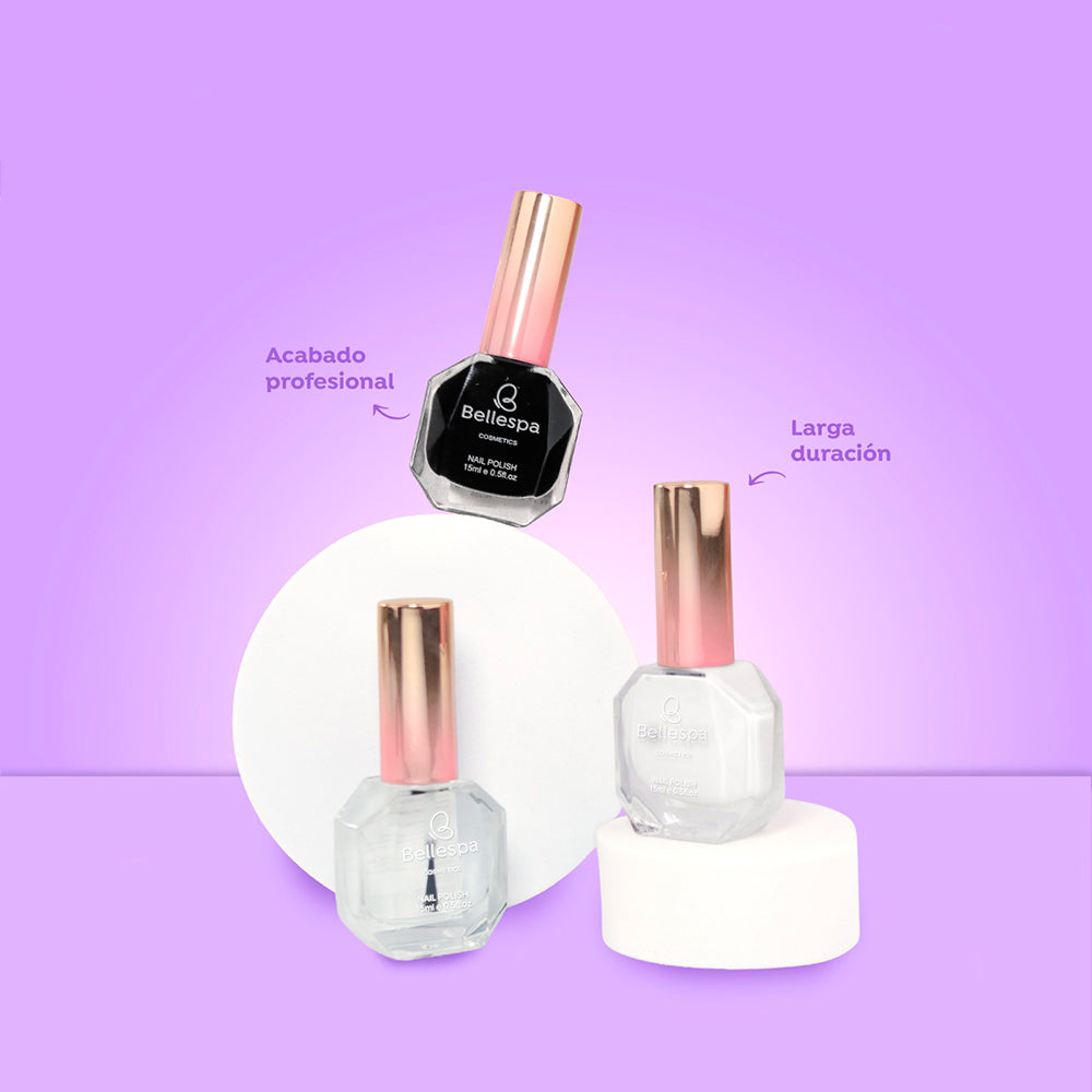 Esmalte de uñas nail polish acabado profesional larga duración Bellespa Cosmetics en negro blanco y transparente con tapa rose gold sobre fondo lila