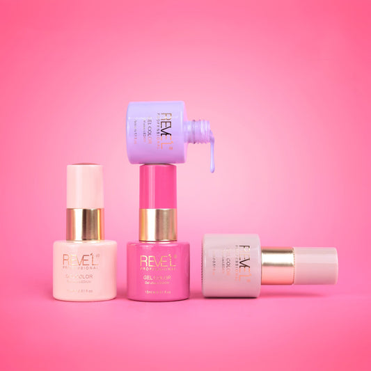 Esmalte gel color LED UV tonos femeninos 15ml Reve'l Professional en rosa palo fucsia lila y nude con detalle de banda dorada sobre fondo rosado