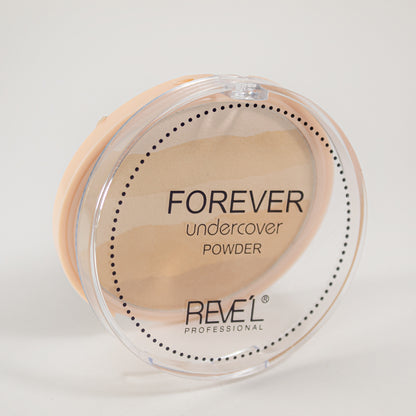 Forever Undercover Polvo Compacto Reve'l – Empaque redondo transparente cerrado con esponja aplicadora, fondo blanco