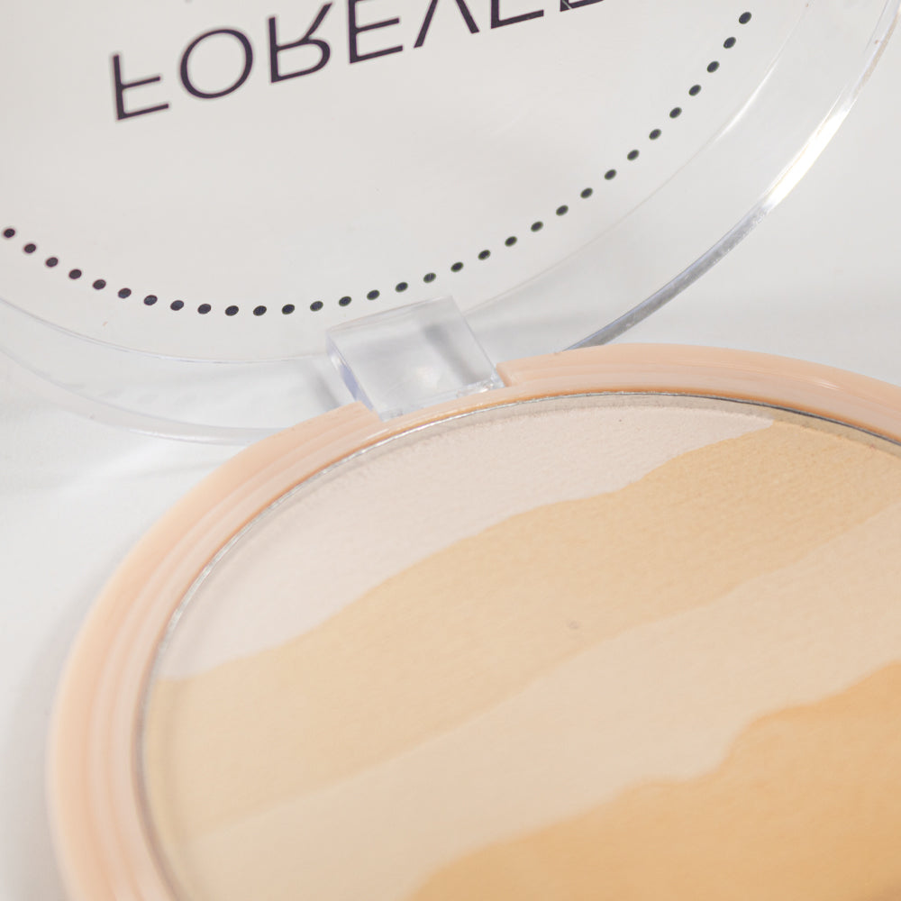 Forever Undercover Polvo Compacto Reve'l – Vista interior del polvo marmoleado en tonos nude y beige con tapa transparente abierta