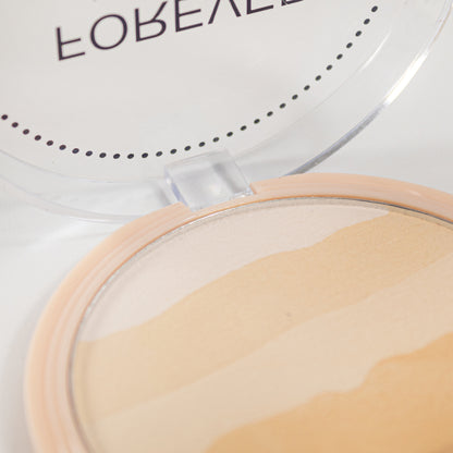 Forever Undercover Polvo Compacto Reve'l – Vista interior del polvo marmoleado en tonos nude y beige con tapa transparente abierta