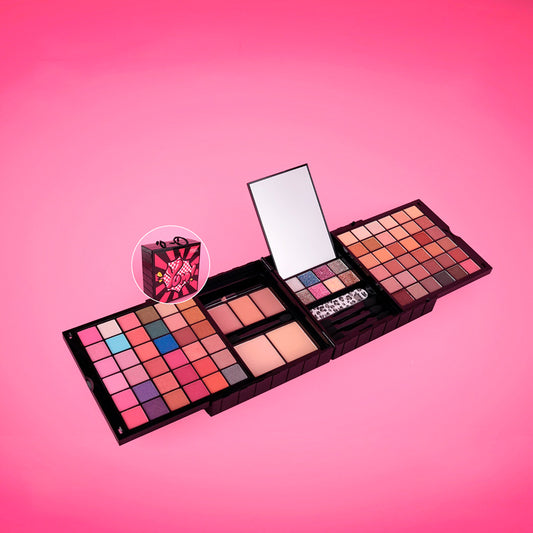 Kit Maquillaje Plegable Completo Reve'l abierto con espejo integrado mostrando sombras vibrantes y neutras rubores polvos iluminadores y glitter diseño pop art
