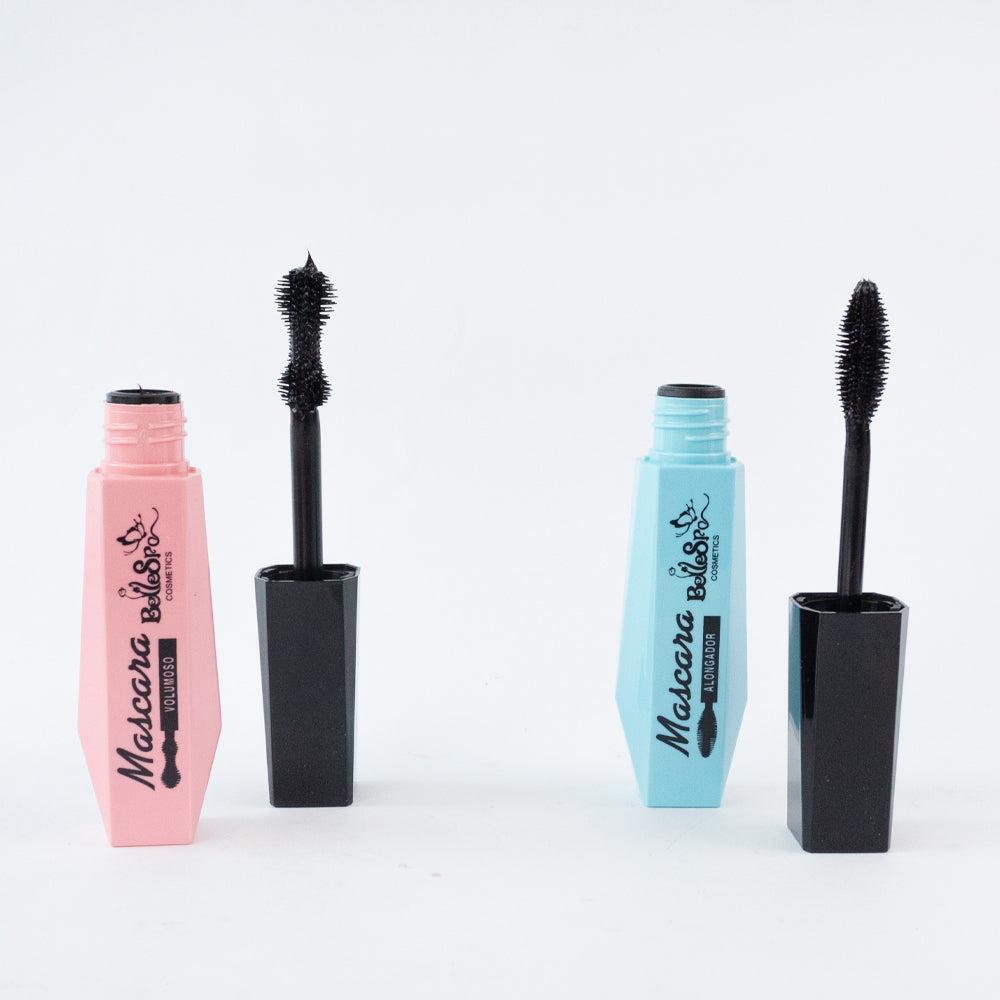 Bellespa Mascara Volumoso en tubo rosa y Alongador en tubo azul abiertos con cepillo sobre fondo blanco