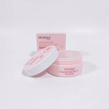 Parches de ojos Nonapeptide Sakura Eye Mask Bioaqua con tapa abierta y caja, envase rosa con parches hidratantes para contorno de ojos
