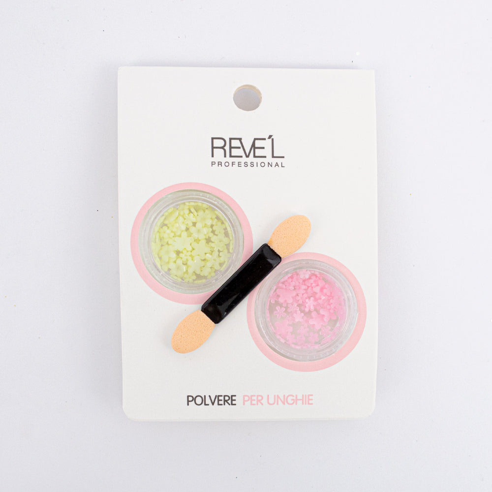 Decoración para uñas Revel Professional polvere per unghie flores amarillo y rosa con aplicador sobre fondo blanco
