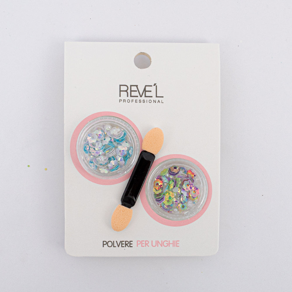 Decoración para uñas Revel Professional polvere per unghie lentejuelas holográficas iridiscentes con aplicador sobre fondo blanco vista lateral