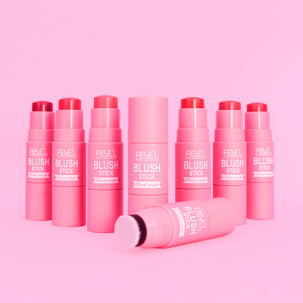 Rubor Blush Stick Cheek Rouge con brocha integrada en múltiples tonos rosa coral y rojo sobre fondo rosa — Reve'l Professional