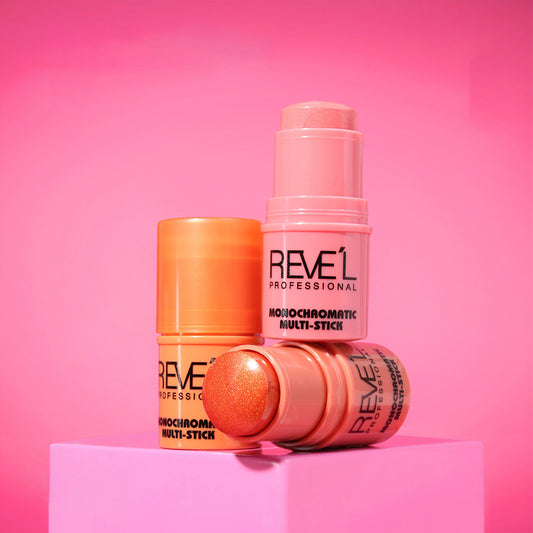 Rubor en barra Monochromatic Multi-Stick Reve'l Professional en tonos rosa y naranja coral sobre fondo fucsia