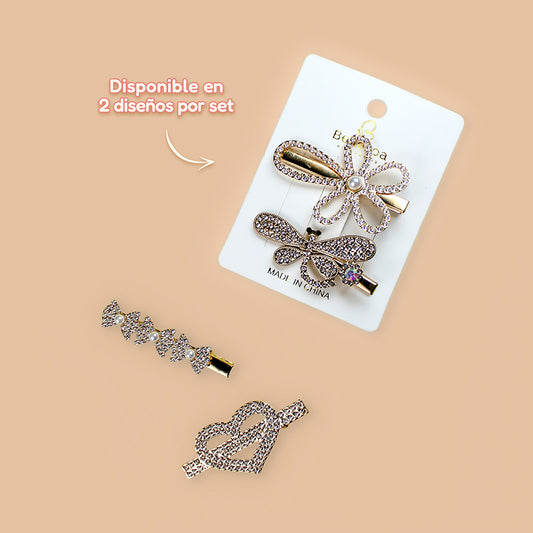Set de ganchos pico de pato dorado con diamantes de fantasía en 2 diseños mariposa con flor y lazo con corazón